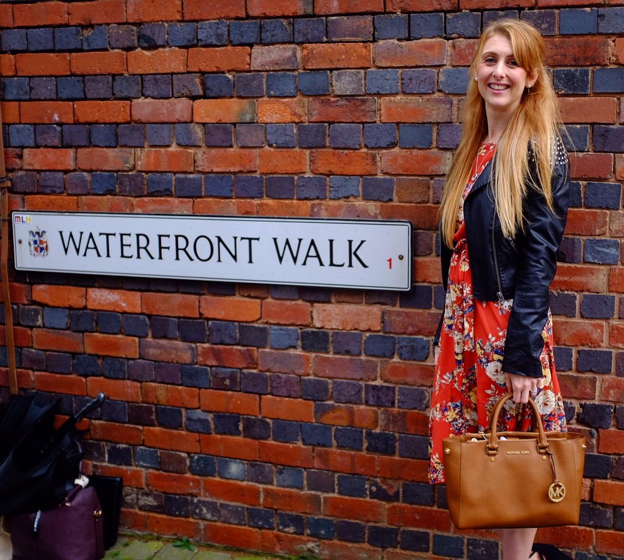 waterfront walk sign. and girl