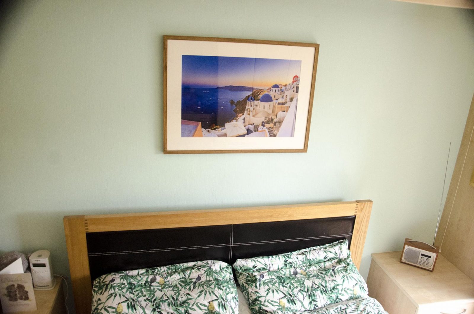 Santorini picture on the wall of a bedroom