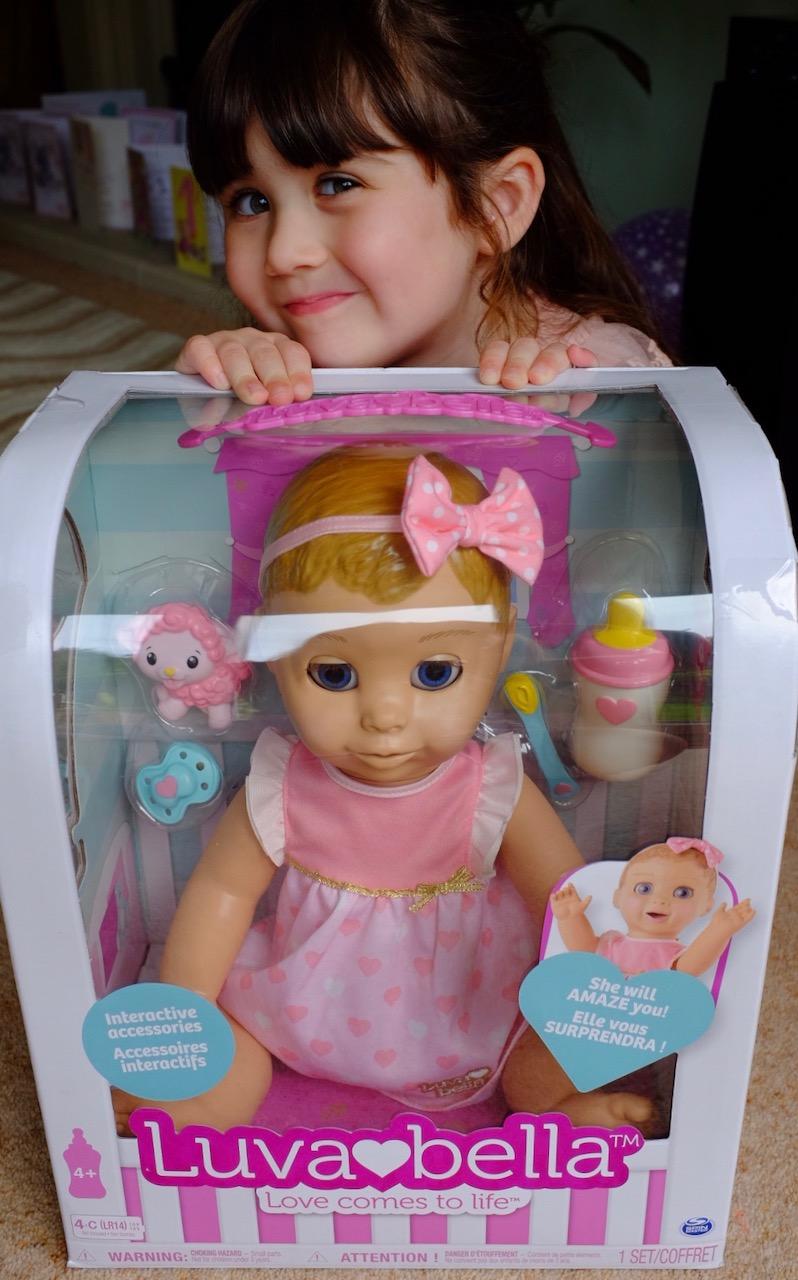 girl with luvabella doll box