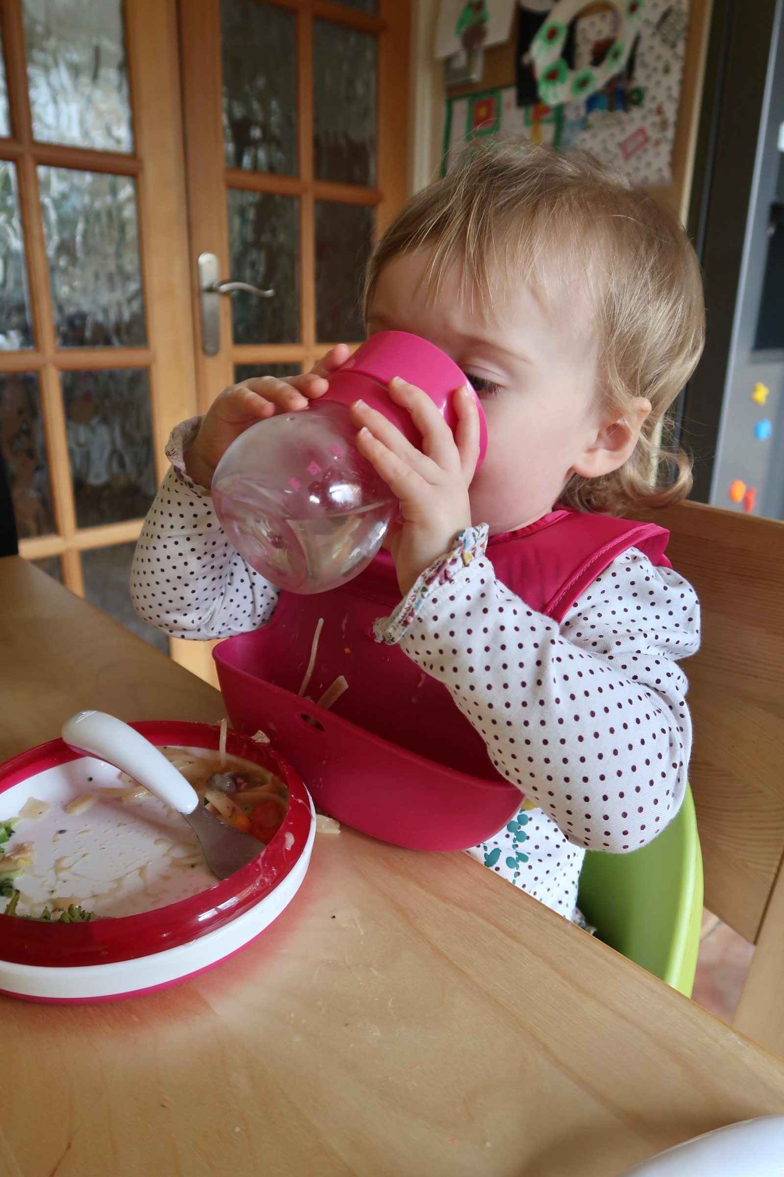 baby drinking from a oxo tot cup