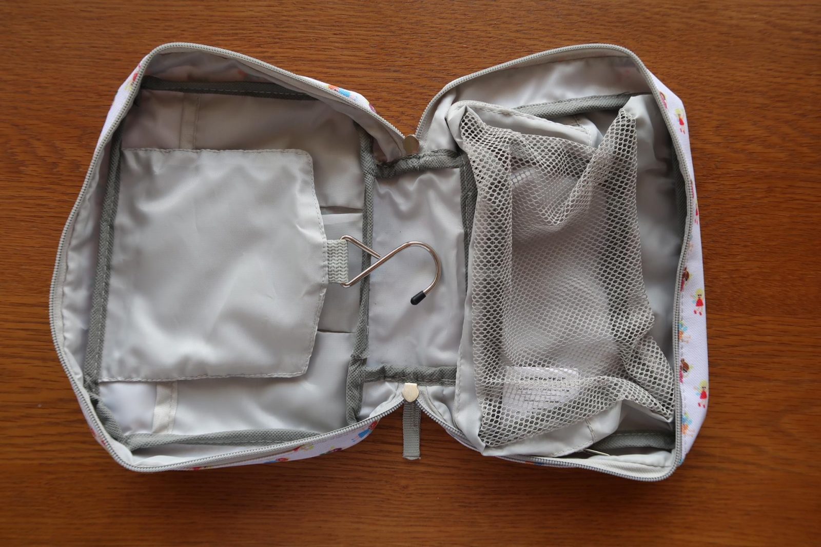 Inside a tiddler and nippers travel and wash bag
