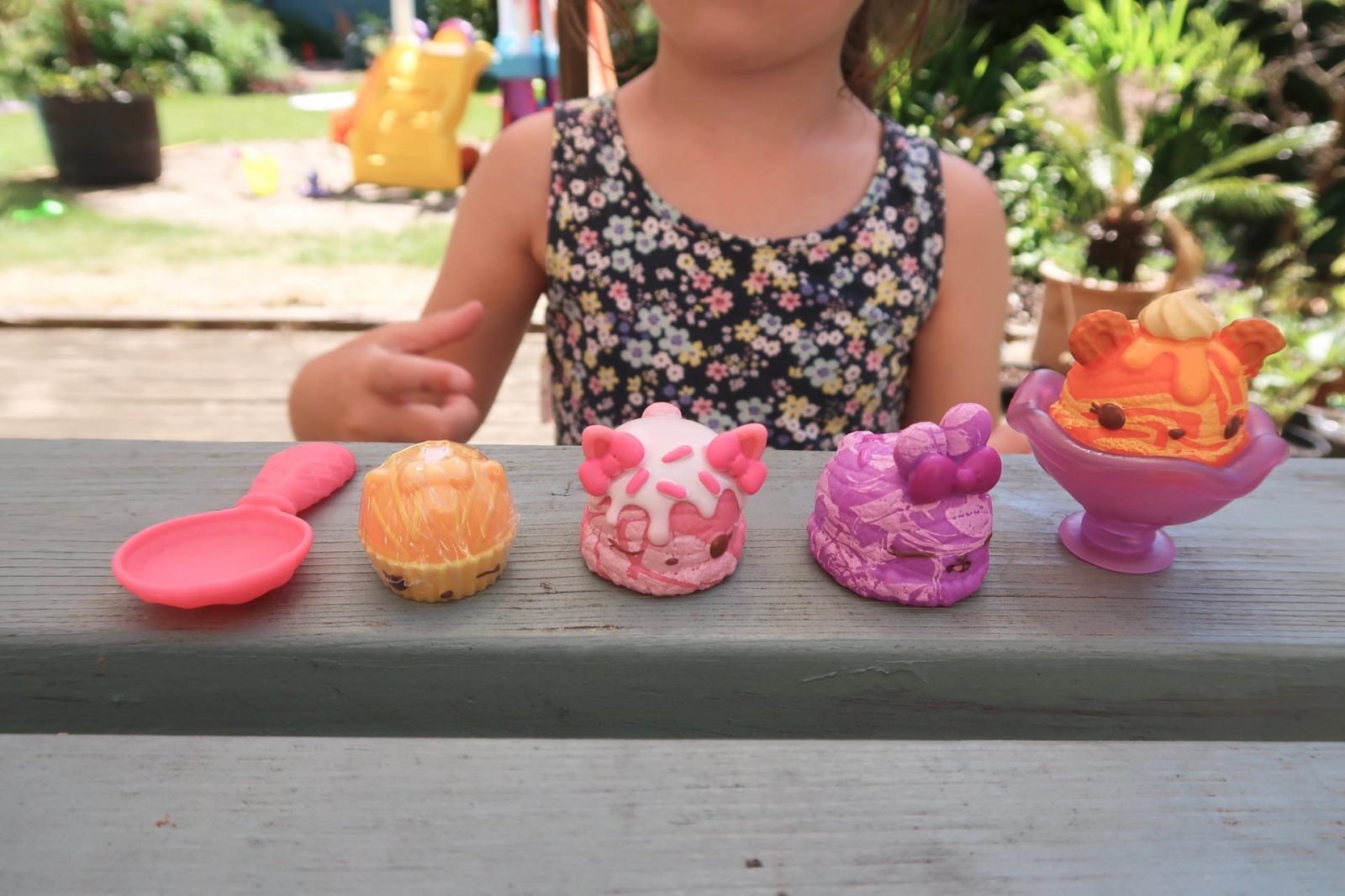 girl playing Num Noms Series 5 marble ice cream starter pack
