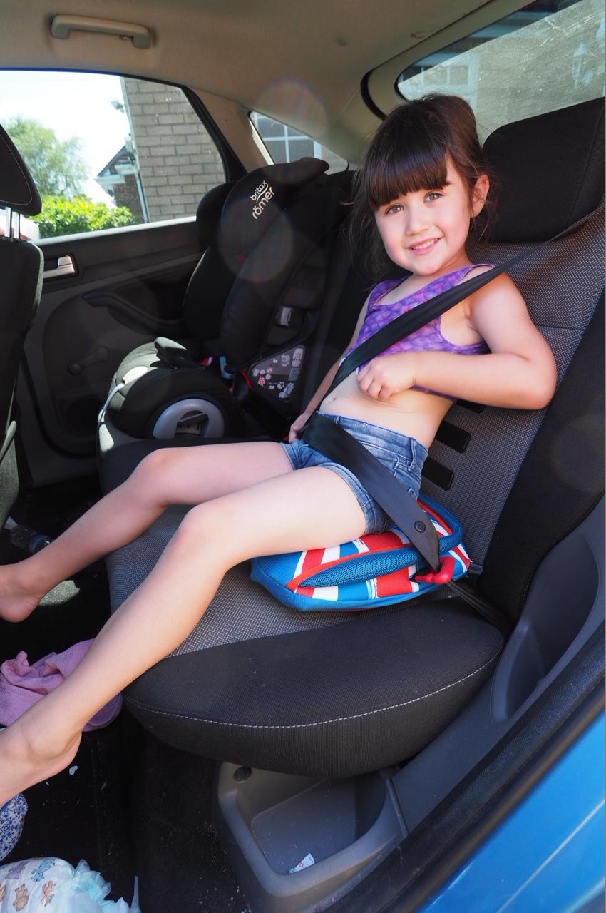 child sitting on bubblebum booster seat