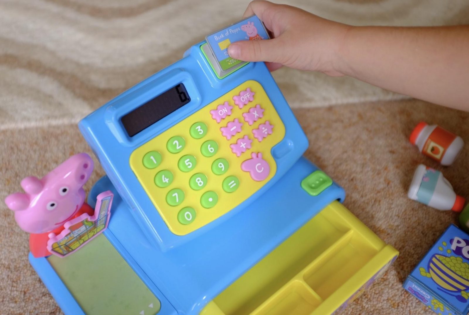 using the chip and pin card on the Peppa Pig Cash Register