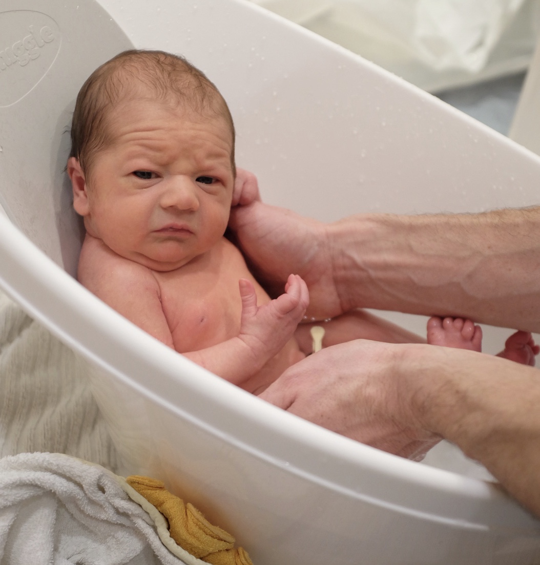 baby boy in a baby bath
