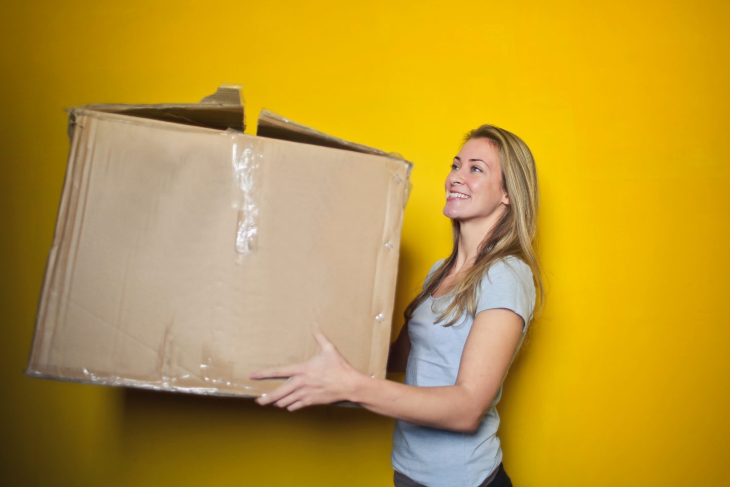 woman moving a box