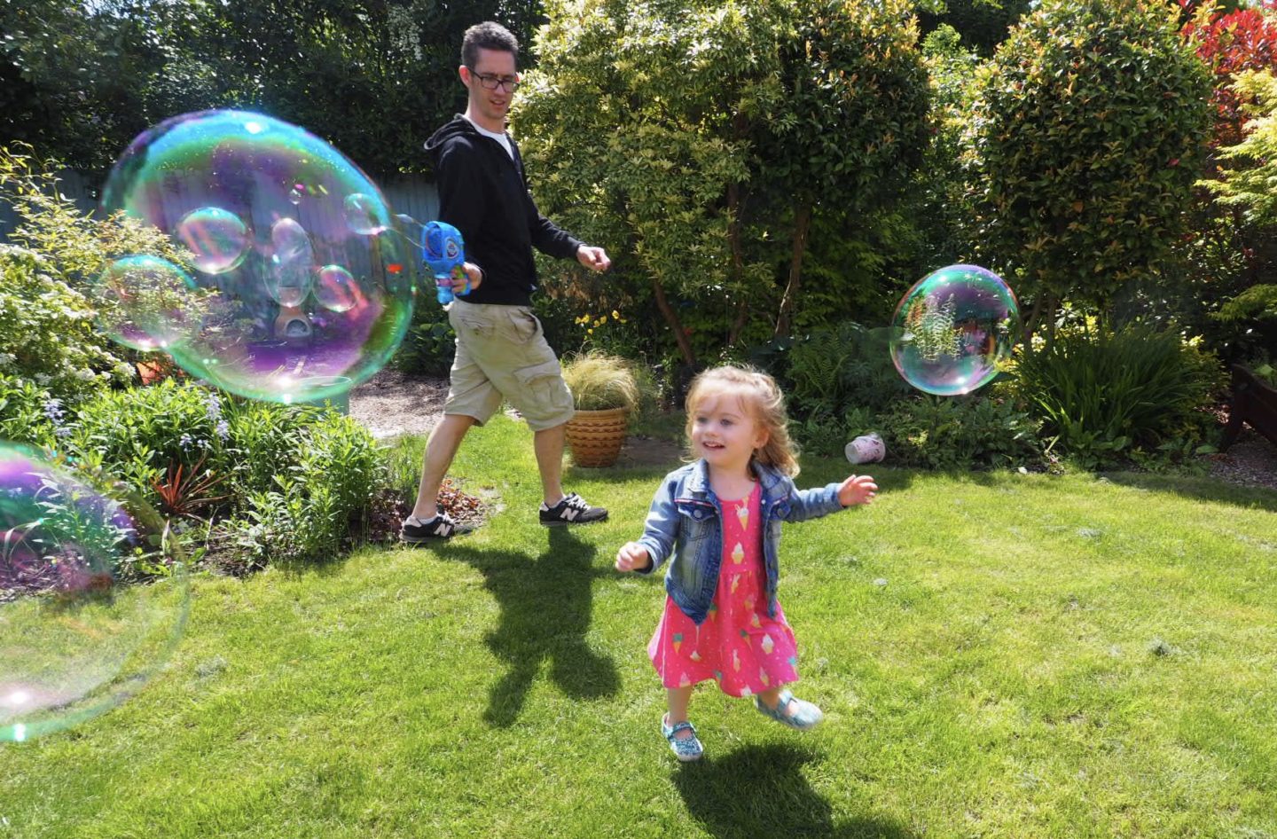 girl playing with mega bubble blaster