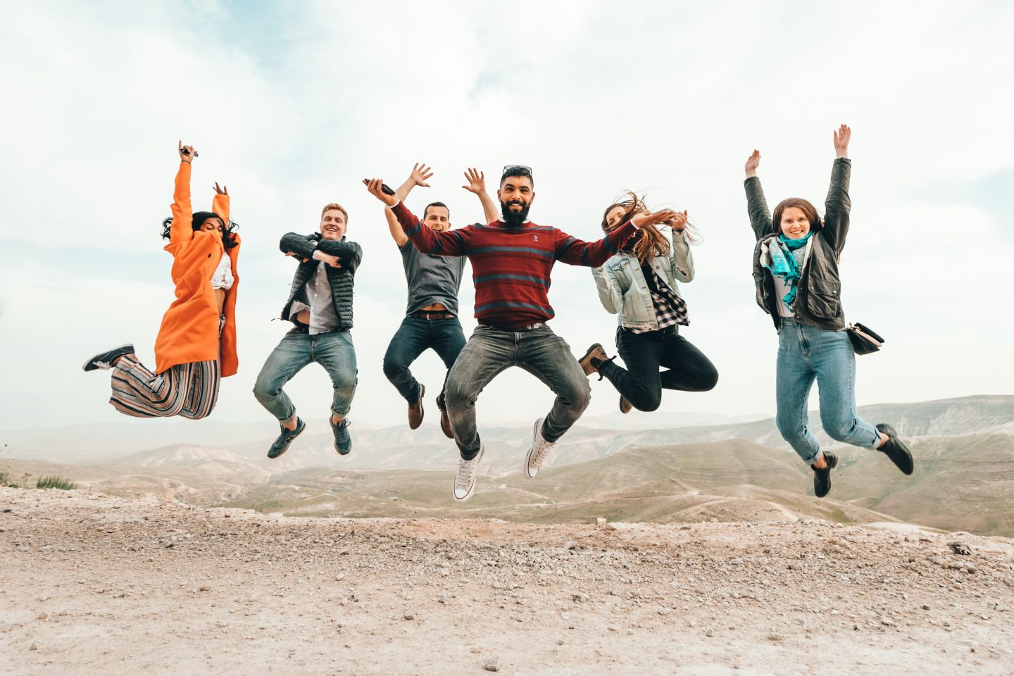 Group of people jumping in the air
