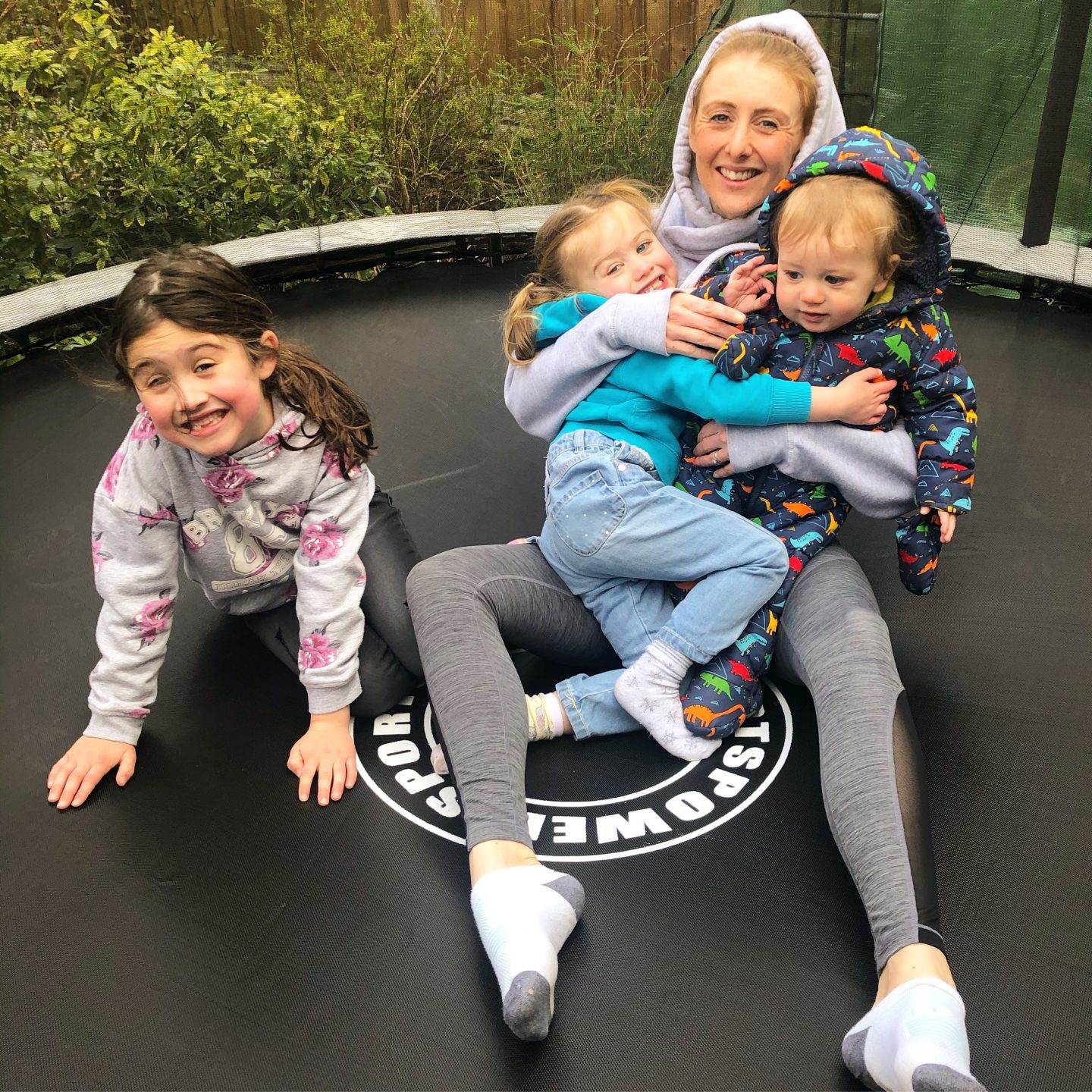 lockdown and I'm tired - Mum and kids on the trampoline