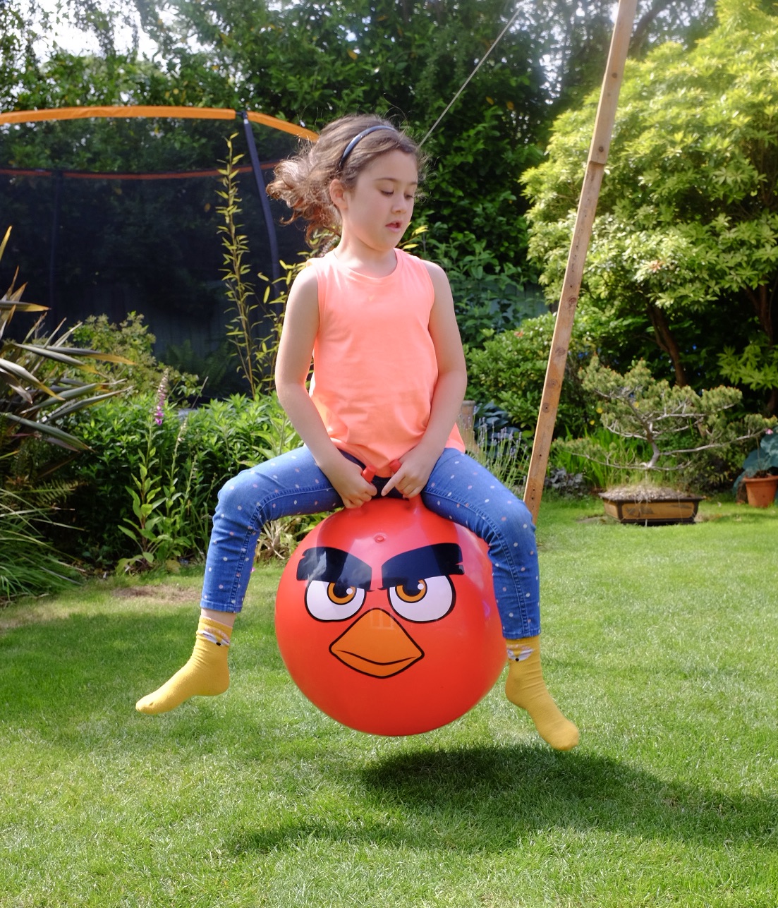 girl on angry birds space hopper