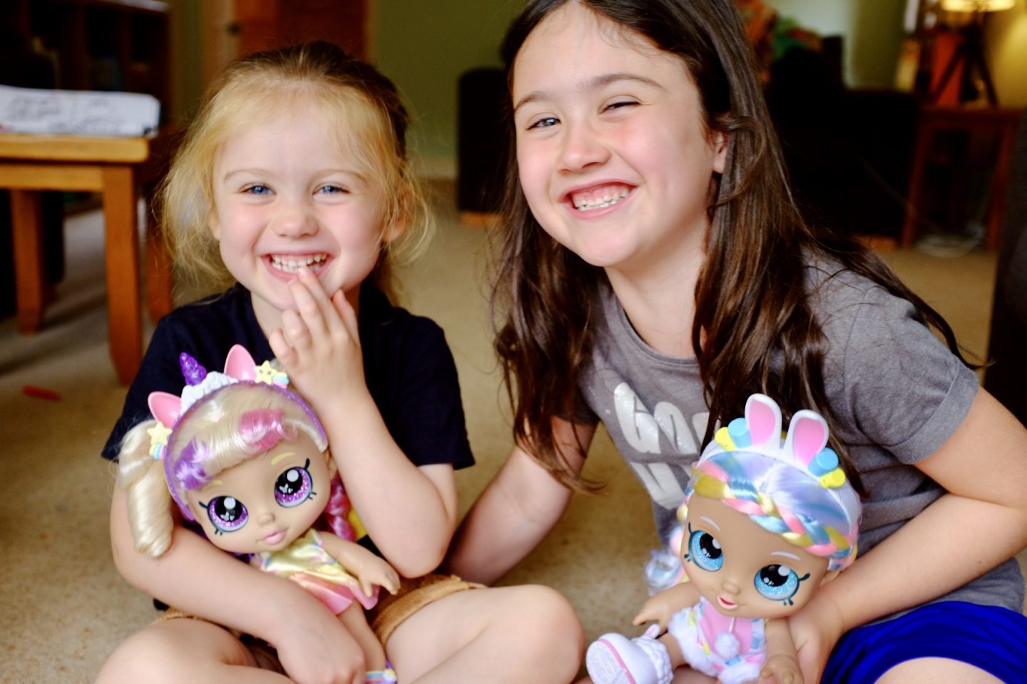 two girls with Kindi Kids dress up dolls