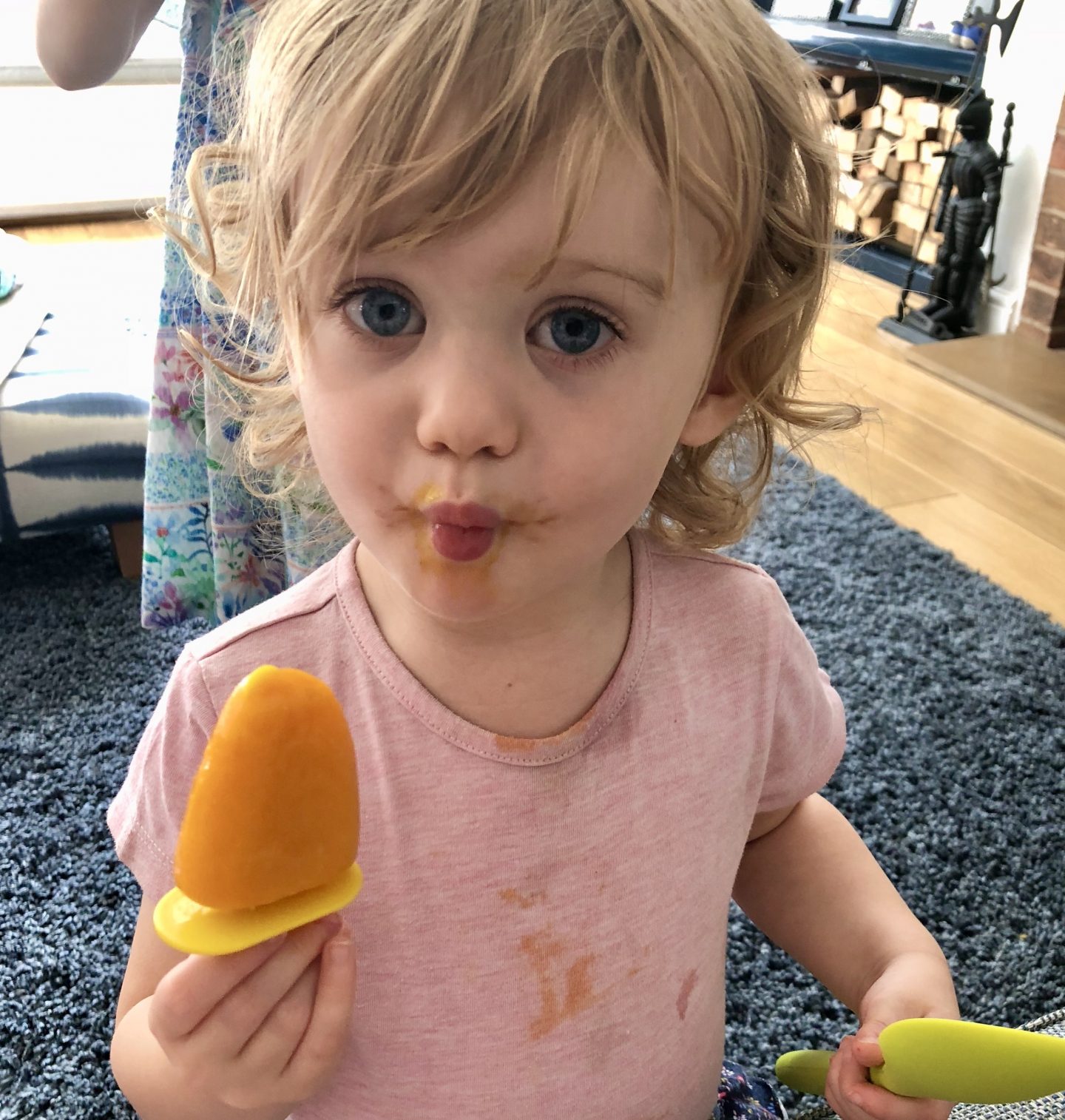 kids to eat more healthily - girl eating a mango lolly