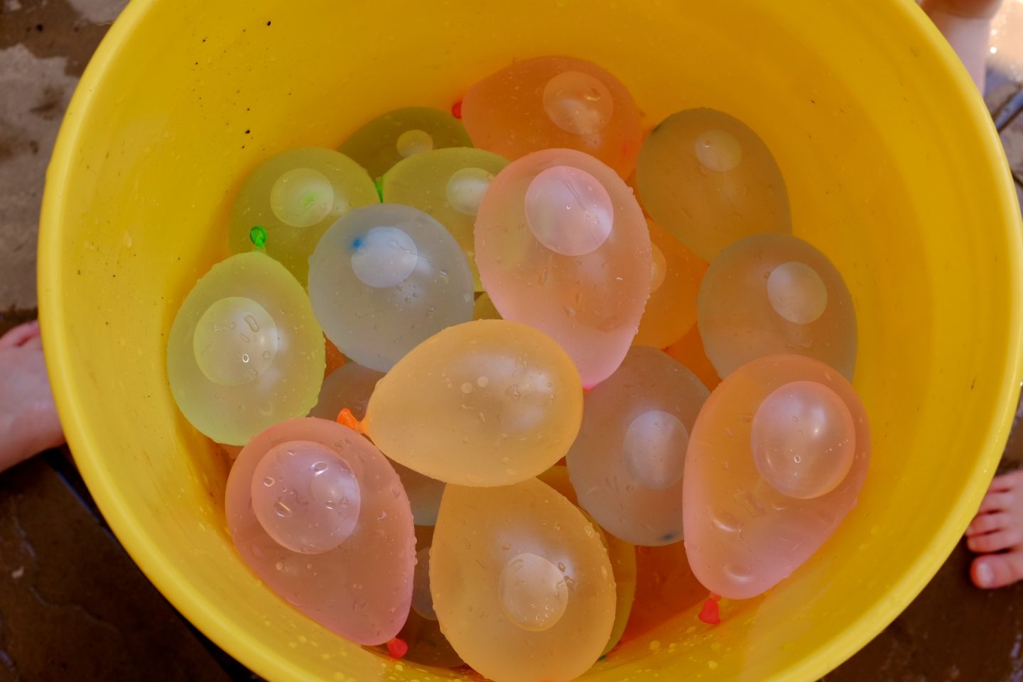 bucket filled with water filled bunch o balloons