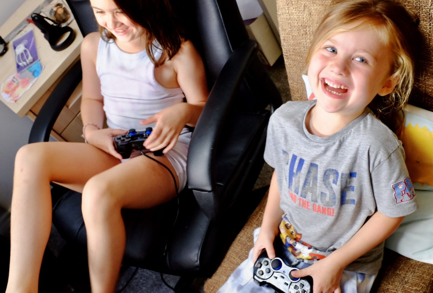 kids laughing playing a video game
