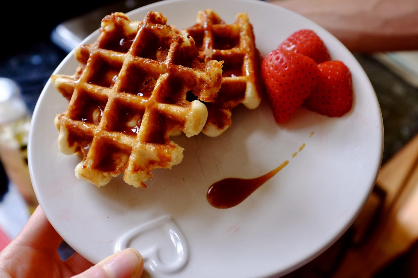 Belgian waffles with bad brownie salted caramel sauce and stawberries